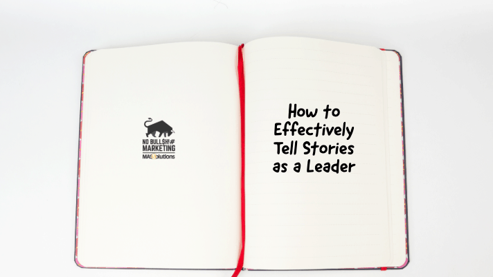 Open notebook with red ribbon and text, "How to Effectively Tell Stories as a Leader"